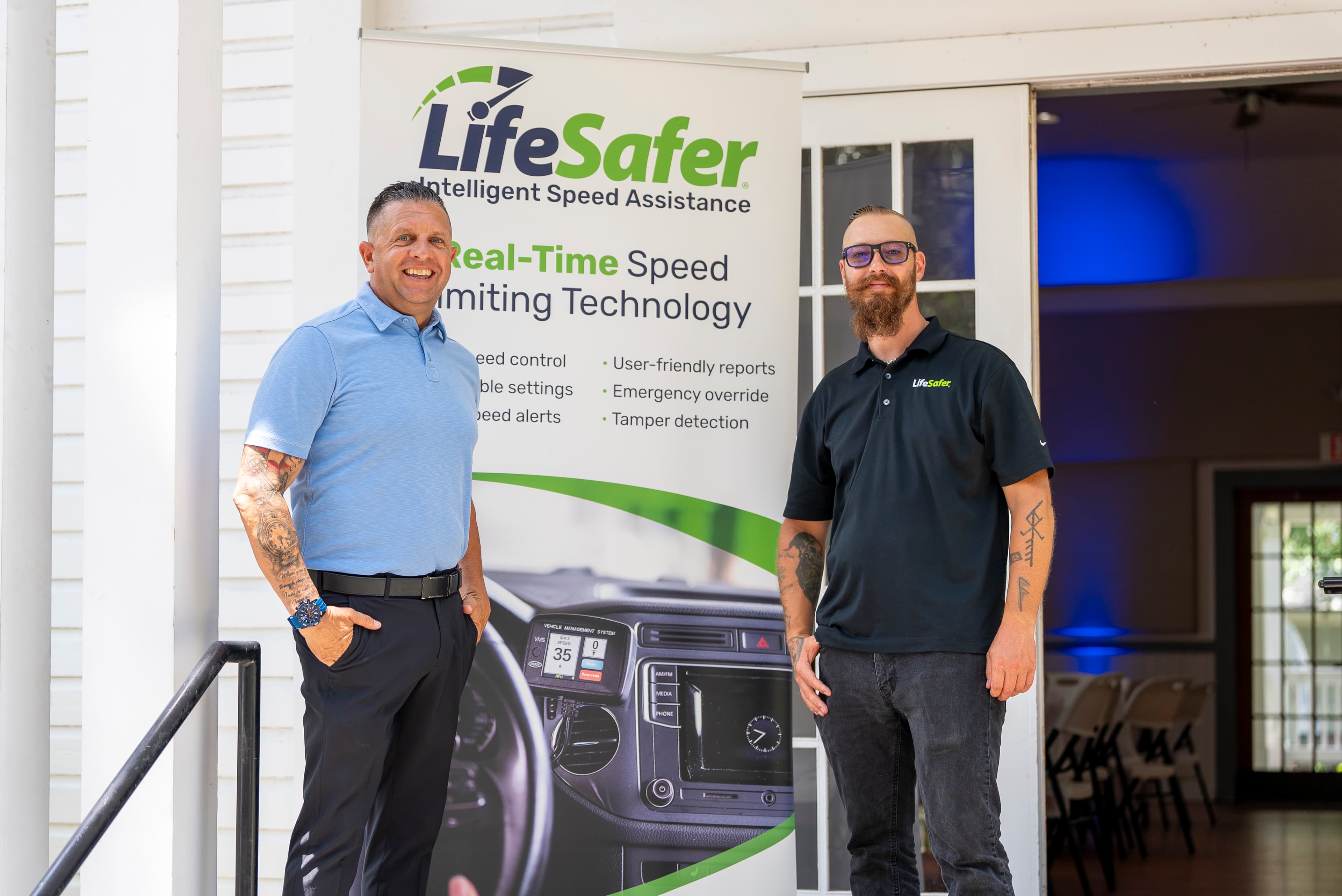 LifeSafer employees standing next to product banner.