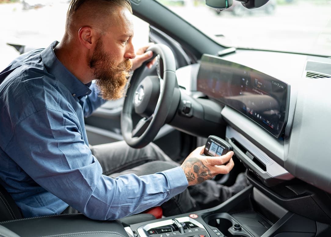 Service professional installing Intelligent Speed Assistance (ISA) to a car